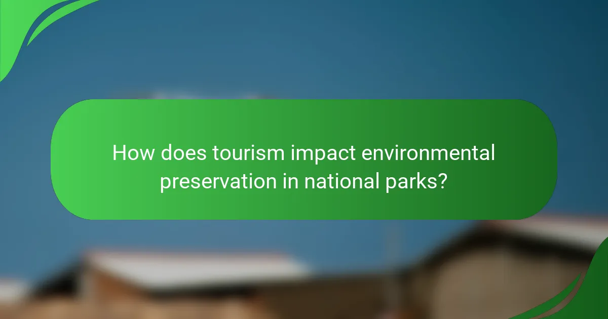 How does tourism impact environmental preservation in national parks?